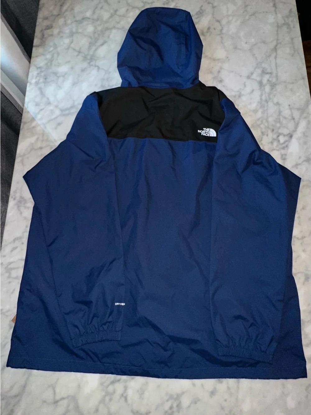 The North Face Blue and Black Hooded Rain Jacket